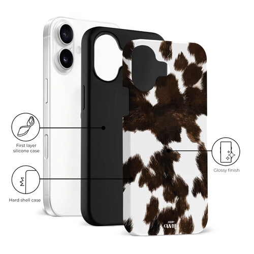 iPhone 16 hoesje met realistische bruin-witte koeienvacht print, dubbellaags bescherming en hoogglans afwerking.