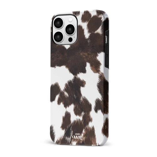 Midnight Rodeo iPhone hoesje met realistische bruin-witte koeienvacht print en hoogglans afwerking.