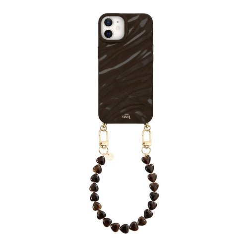 iPhone 11 Glaze Cord Case in Sweetheart Brown with a short heart-beaded wrist strap.