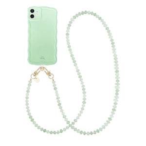 Glossy Wavy iPhone 11 case in sage green with a long, beaded dusty green cord.