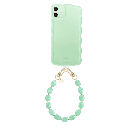 Glossy wavy sage green iPhone 11 case with a short ocean mint beaded cord and gold clasps.