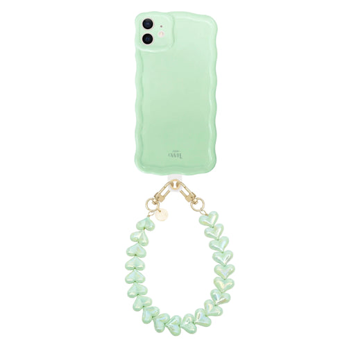 Glossy wavy sage green iPhone 11 case with a detachable funky hearts cord.
