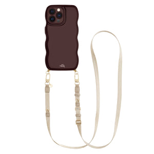 Glossy burgundy wavy iPhone 12 Pro case with a beige adjustable lanyard strap.