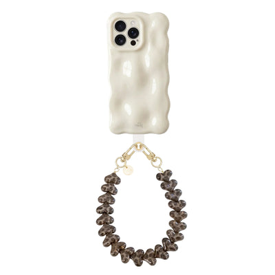 Crèmekleurige Bubbly iPhone 14 Pro Max hoes met golvende vorm en Funky Hearts Leopard koord.