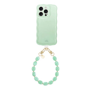 Glossy wavy sage green iPhone 16 Pro Max case with an ocean mint beaded short cord.