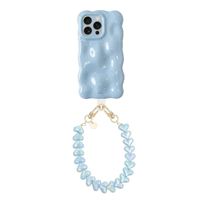 Bubbly Ice Blue telefoonhoesje met golvende vorm en Funky Hearts Cord van blauwe metallic hartjes.