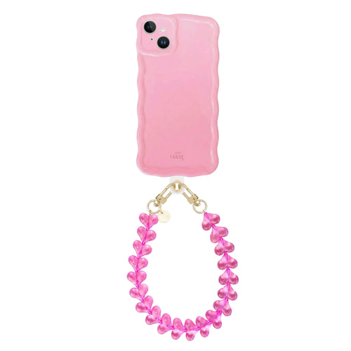 Glossy wavy light pink iPhone 13 case with a detachable Funky Hearts cord.