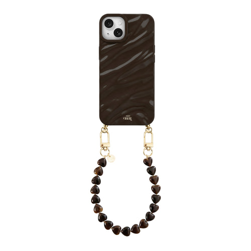 iPhone 14 Glaze Cord Case in Sweetheart Brown with a short, brown heart-beaded wrist strap.