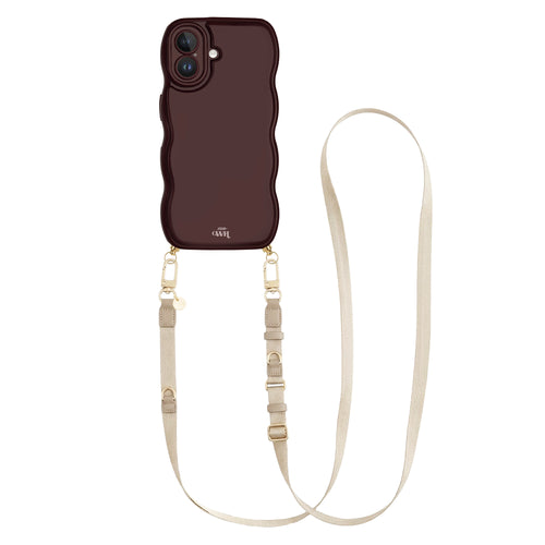 Glossy burgundy wavy iPhone 16 case with a beige adjustable lanyard strap and gold hardware.