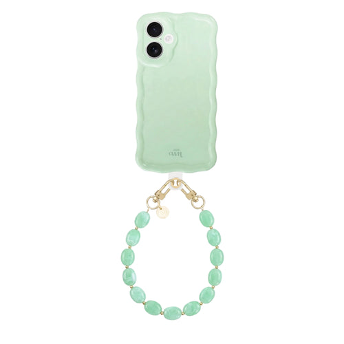Glossy wavy sage green iPhone 17 case with a short ocean mint beaded wrist cord.