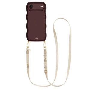 Glossy burgundy iPhone 17 Air case with wavy texture and beige adjustable lanyard strap.