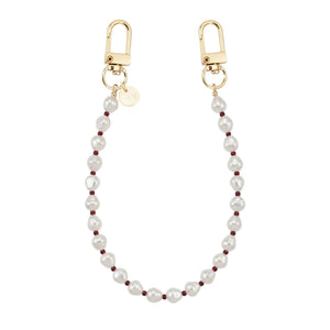 Kort Burgundy Pearl koord met witte parels, bordeauxrode kralen en gouden karabijnhaken.