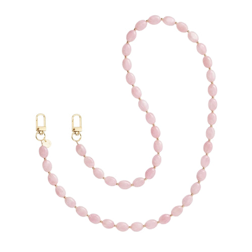 Lang Ocean Blush koord met roze kralen en gouden sluitingen.