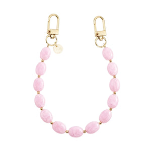 Kort Ocean Blush polskoord met roze marmeren kralen, gouden details en twee gouden sluitingen.
