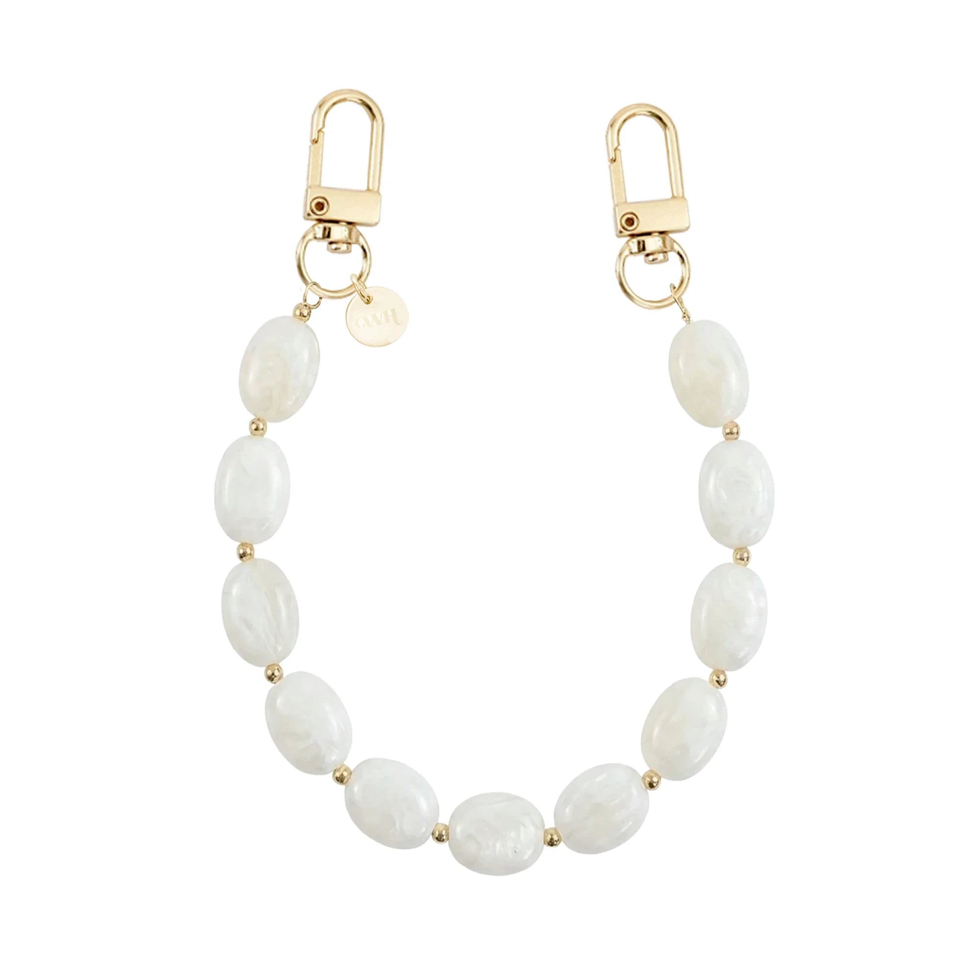 Kort Ocean Sand polskoord met witte ovale kralen, gouden details en twee karabijnsluitingen.