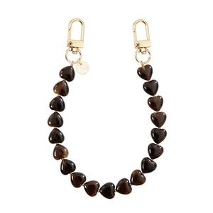 Kort Sweetheart Brown koord met glanzende hartvormige kralen en gouden karabijnhaken.